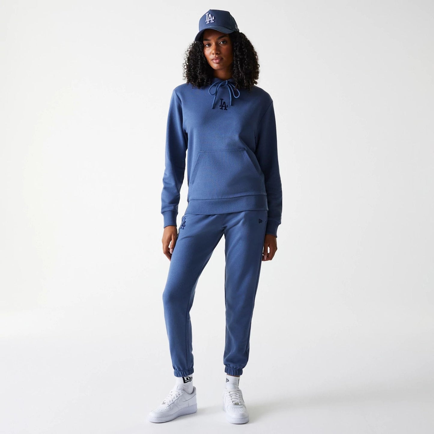 The Female model is wearing LA Dodgers Womens MLB Midi League Essential Dark Blue Pullover Hoodie 8