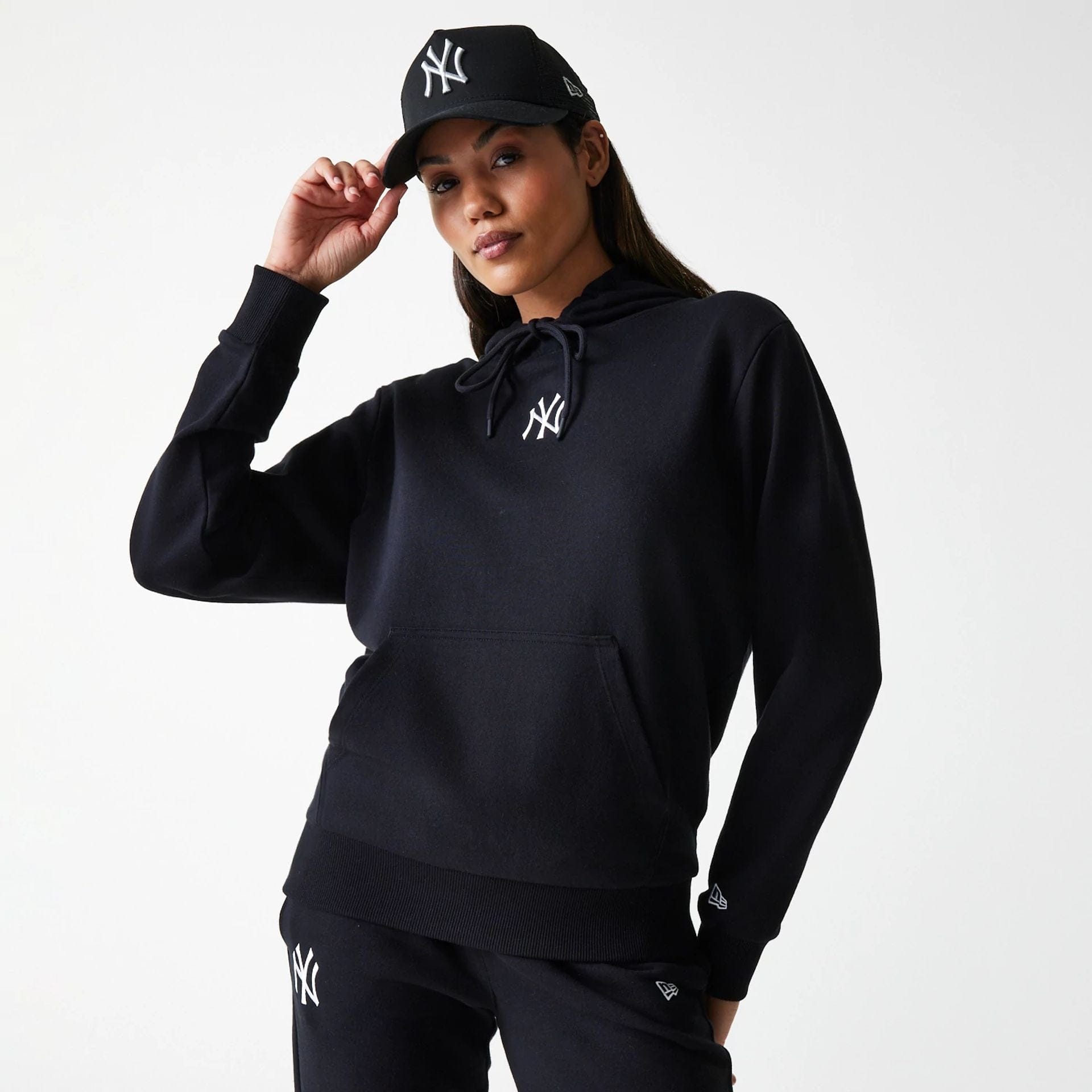 The Female model is wearing New York Yankees Womens MLB Midi League Essential Black Pullover Hoodie 1