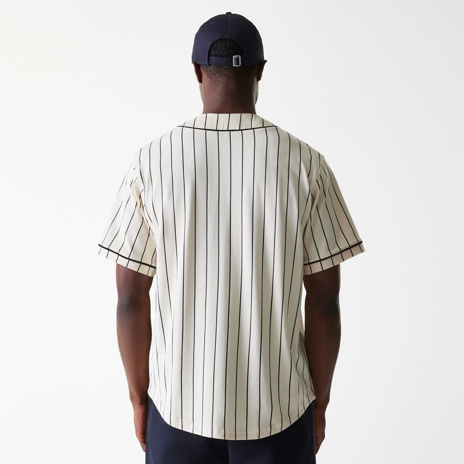 The Male model is wearing New Era Pinstripe Light Beige Jersey 2