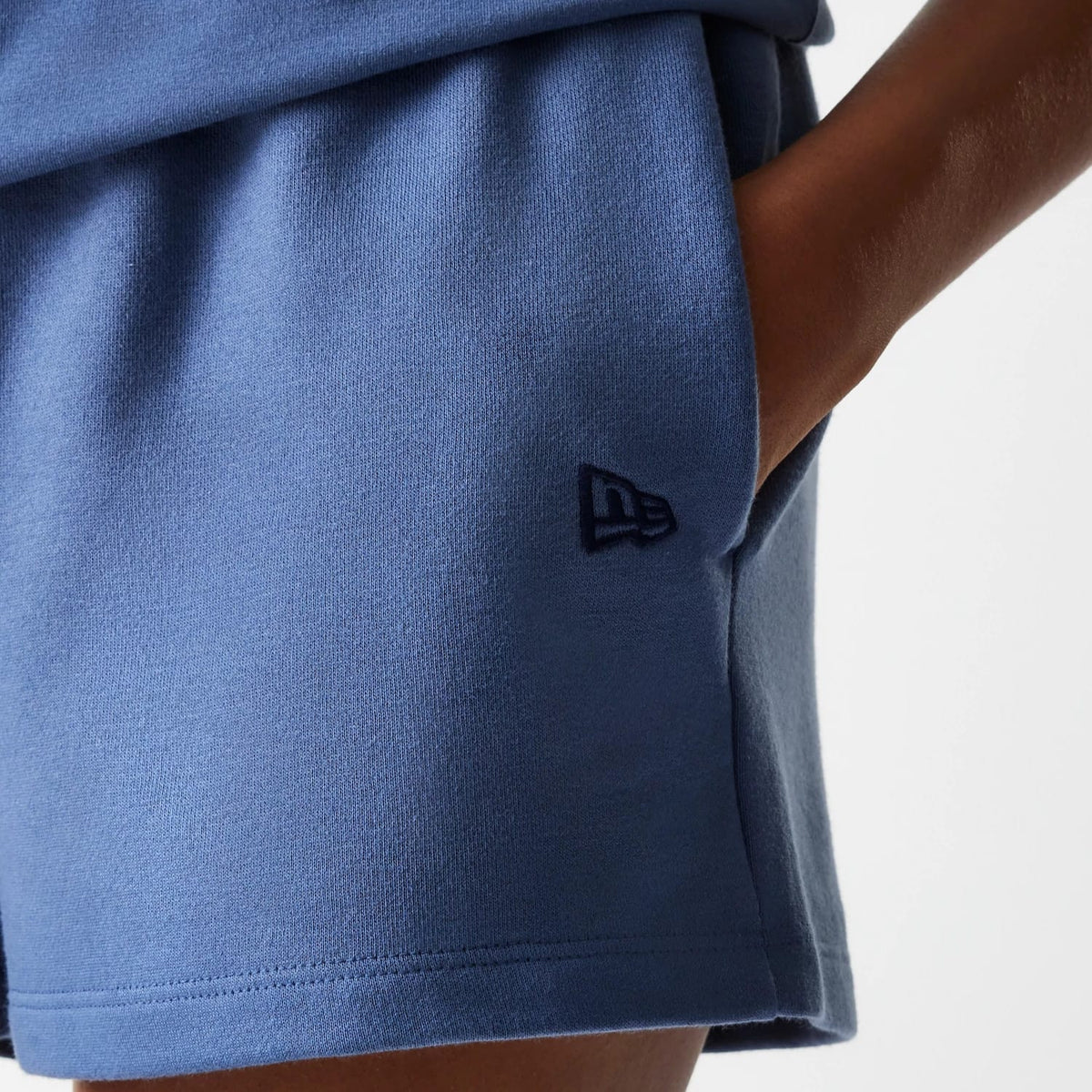 The Female model is wearing LA Dodgers Womens MLB Midi League Essential Dark Blue Shorts 4
