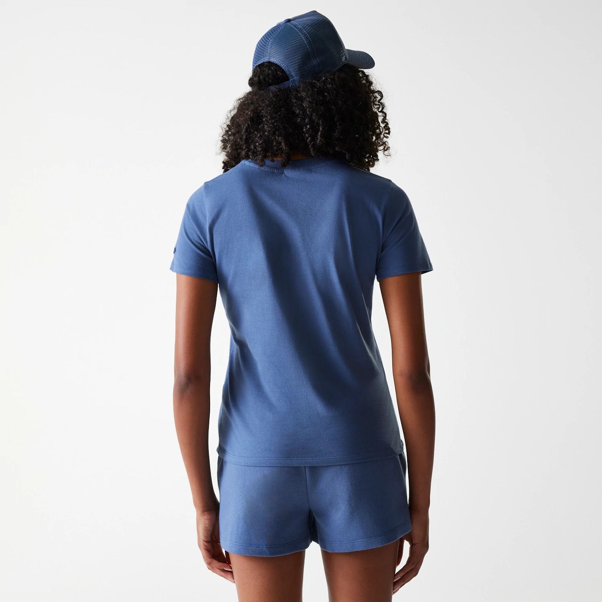 The Female model is wearing LA Dodgers Womens MLB Midi League Essential Dark Blue Shorts 2