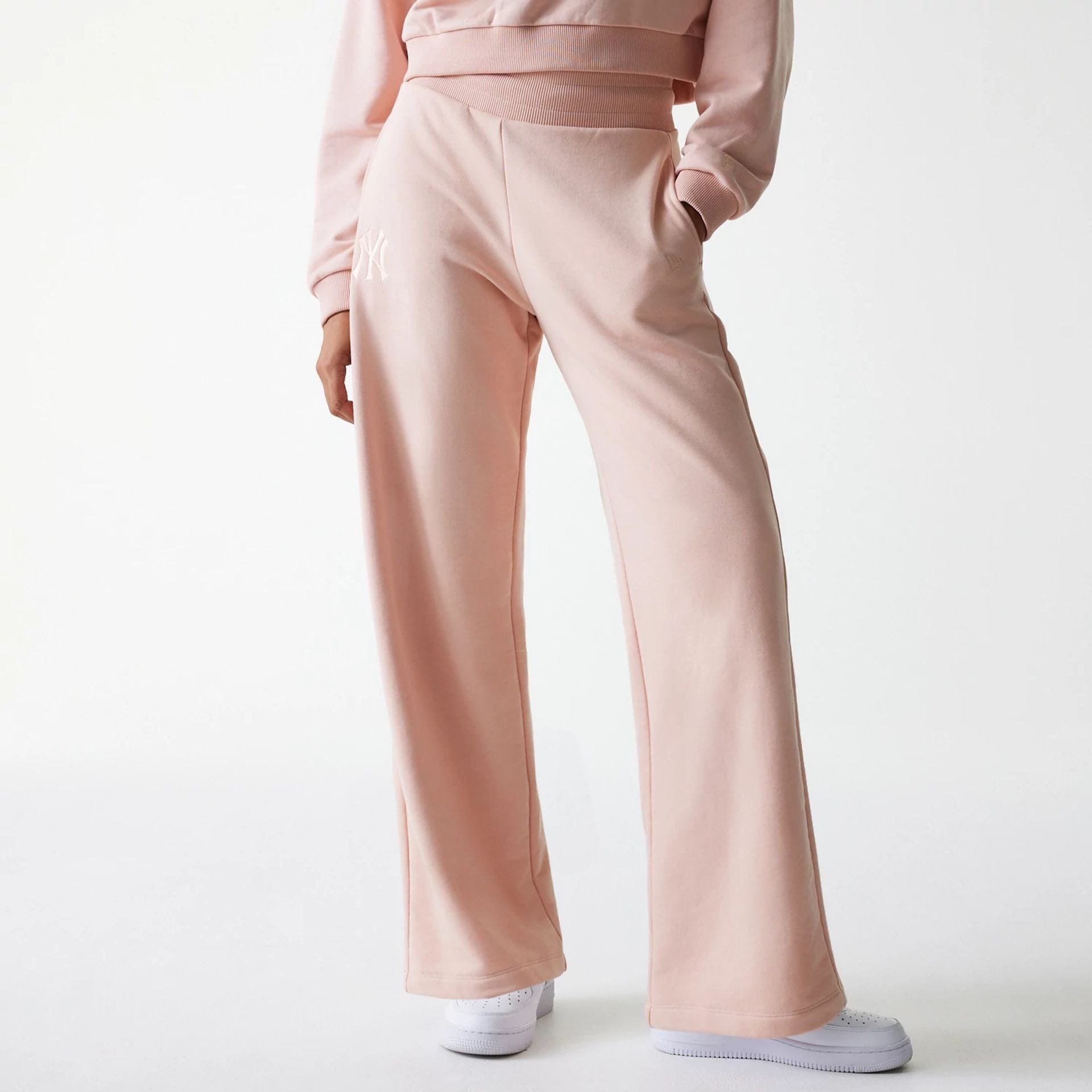 The Female model is wearing New York Yankees Womens MLB Tonal Pastel Pink Straight Leg Joggers 1