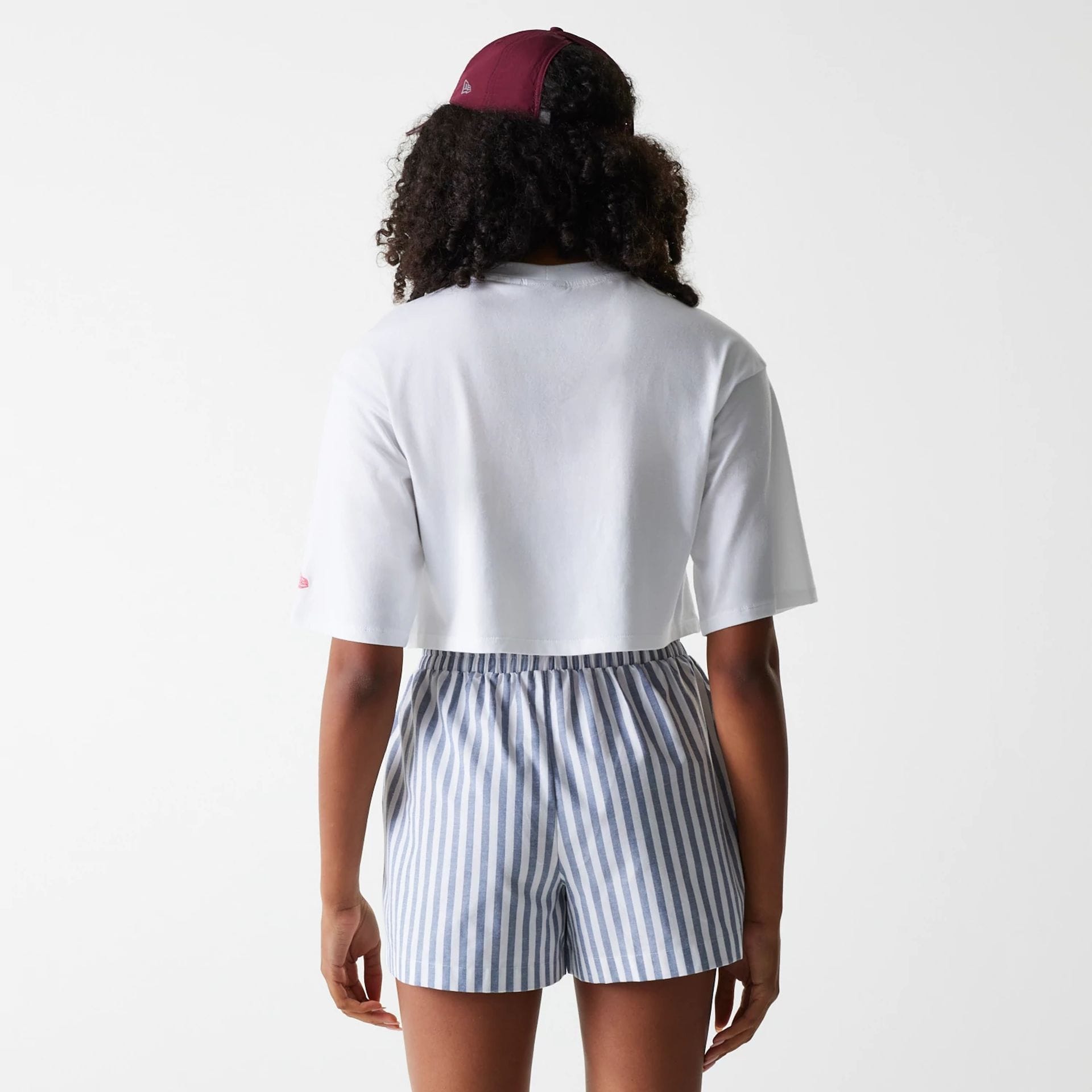 The Female model is wearing New York Yankees Womens MLB Stripe Dark Blue Shorts 2