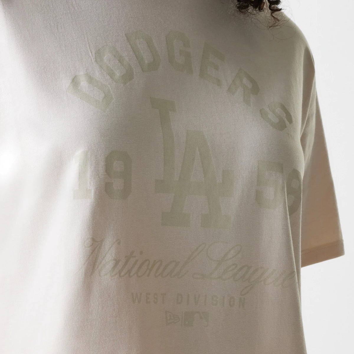 New Era LA Dodgers Womens MLB Tonal Graphic Light Beige Oversized T-Shirt, front view highlighting the debossed Dodgers logo and script, along with the large LA initials and 19 58 displayed on the light beige fabric.