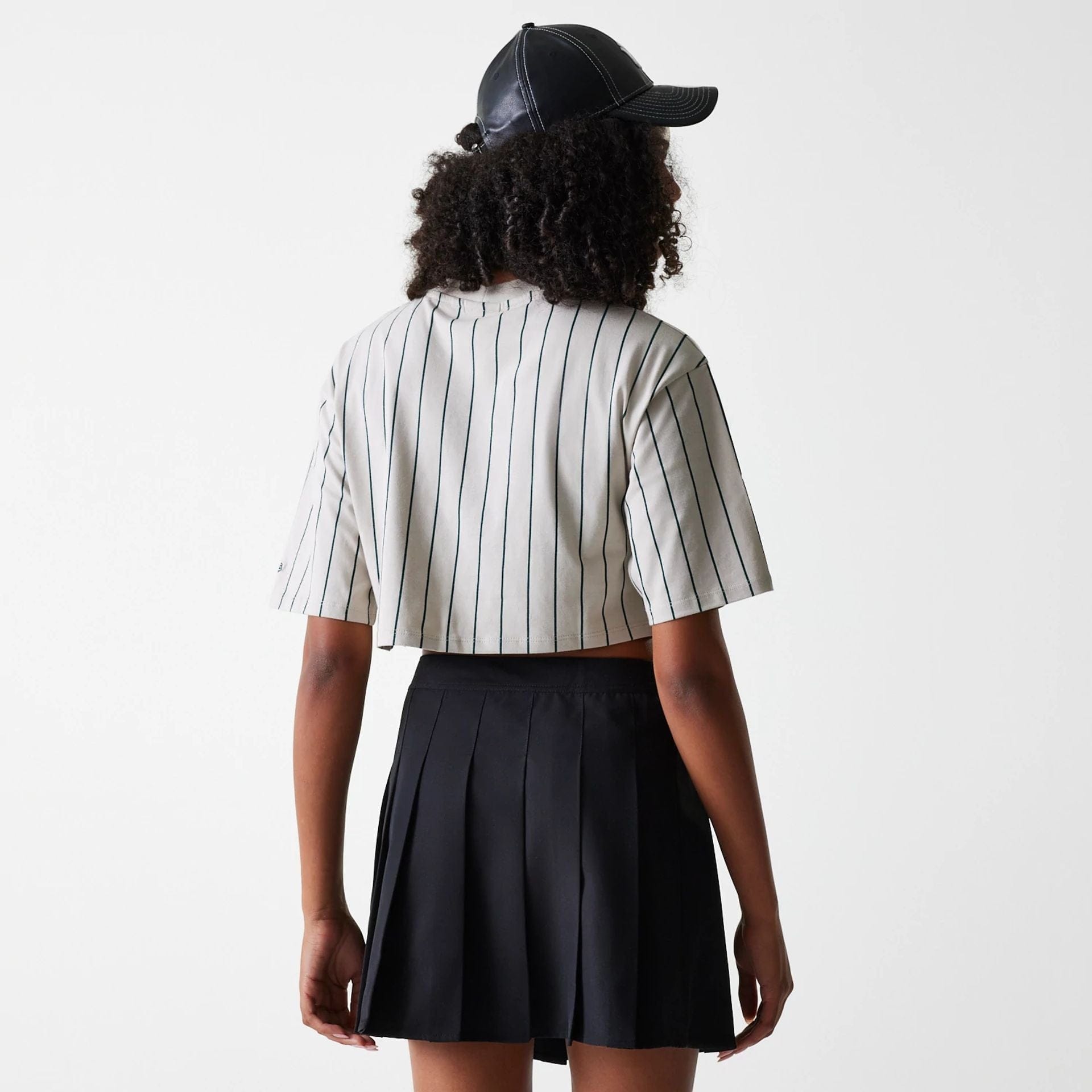 The Female model is wearing New York Yankees Womens MLB Black Tennis Skirt 2
