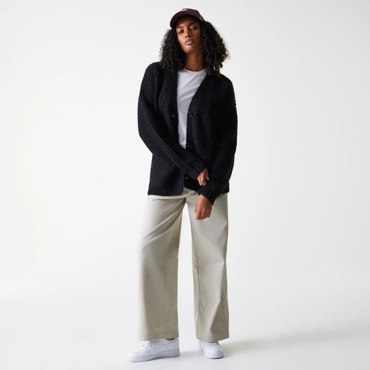 The Female model is wearing New York Yankees Womens MLB Knit Black Cardigan 8