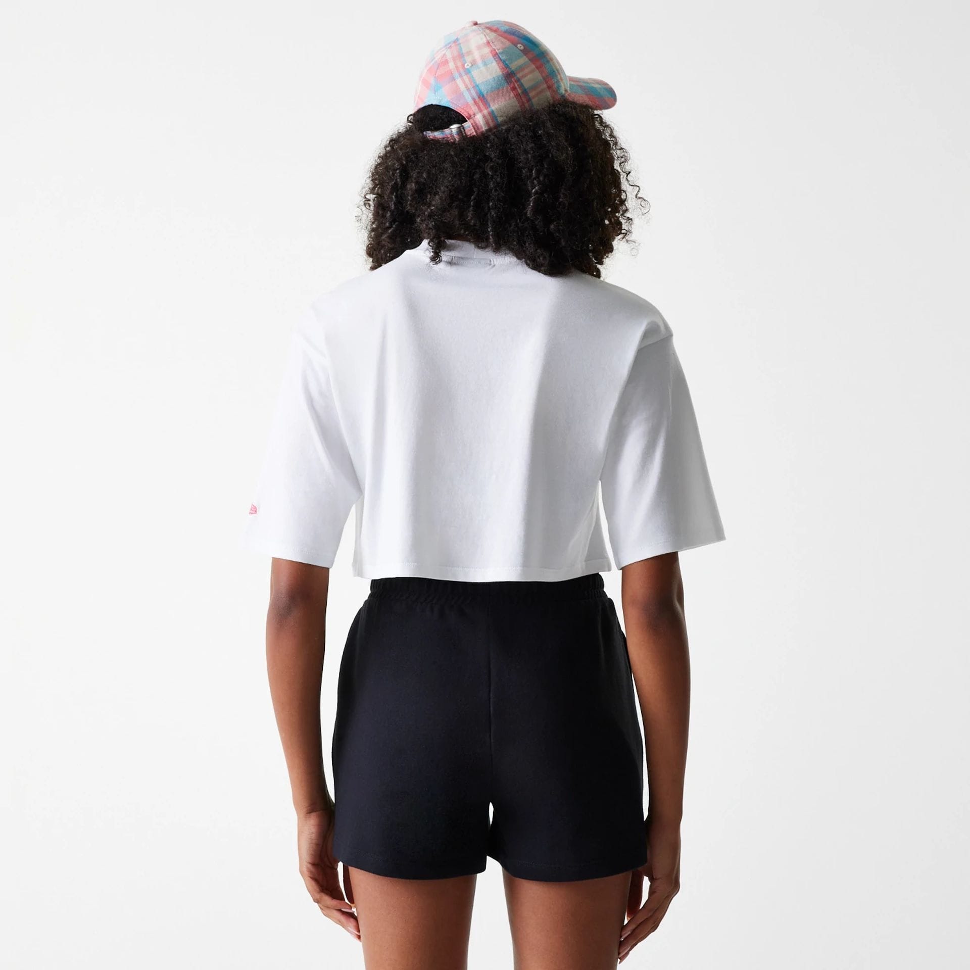 The Female model is wearing New York Yankees Womens League Essential Midi White Crop T-Shirt 2