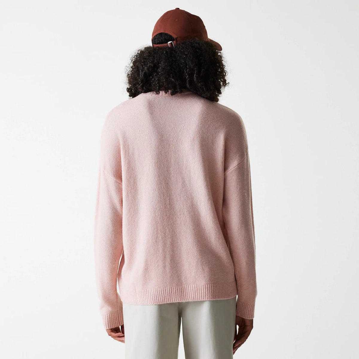 The Female model is wearing New York Yankees Womens MLB Knit Pastel Pink Crew Neck Sweater 2