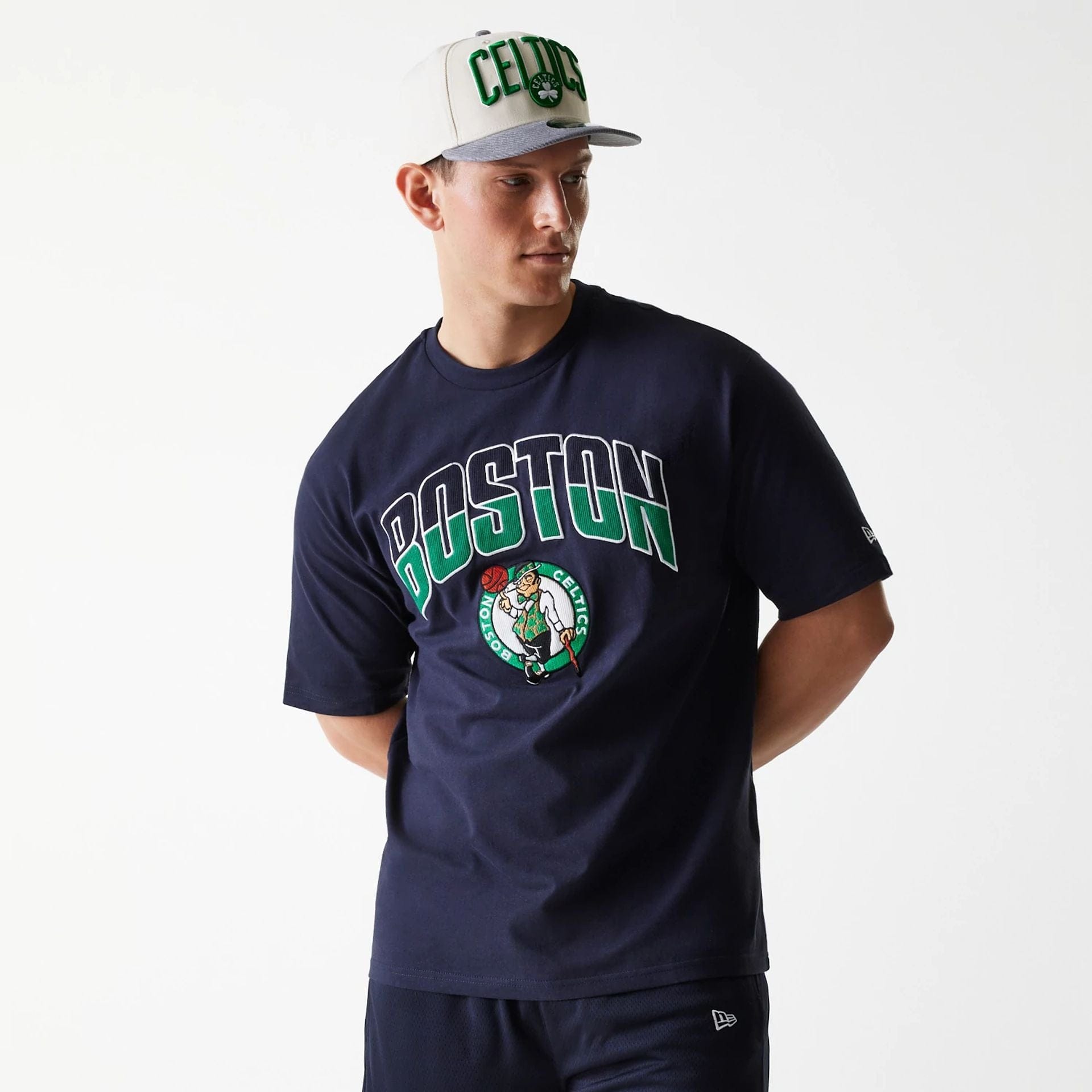 The Male model is wearing Boston Celtics NBA Arch Graphic Navy Oversized T-Shirt 1