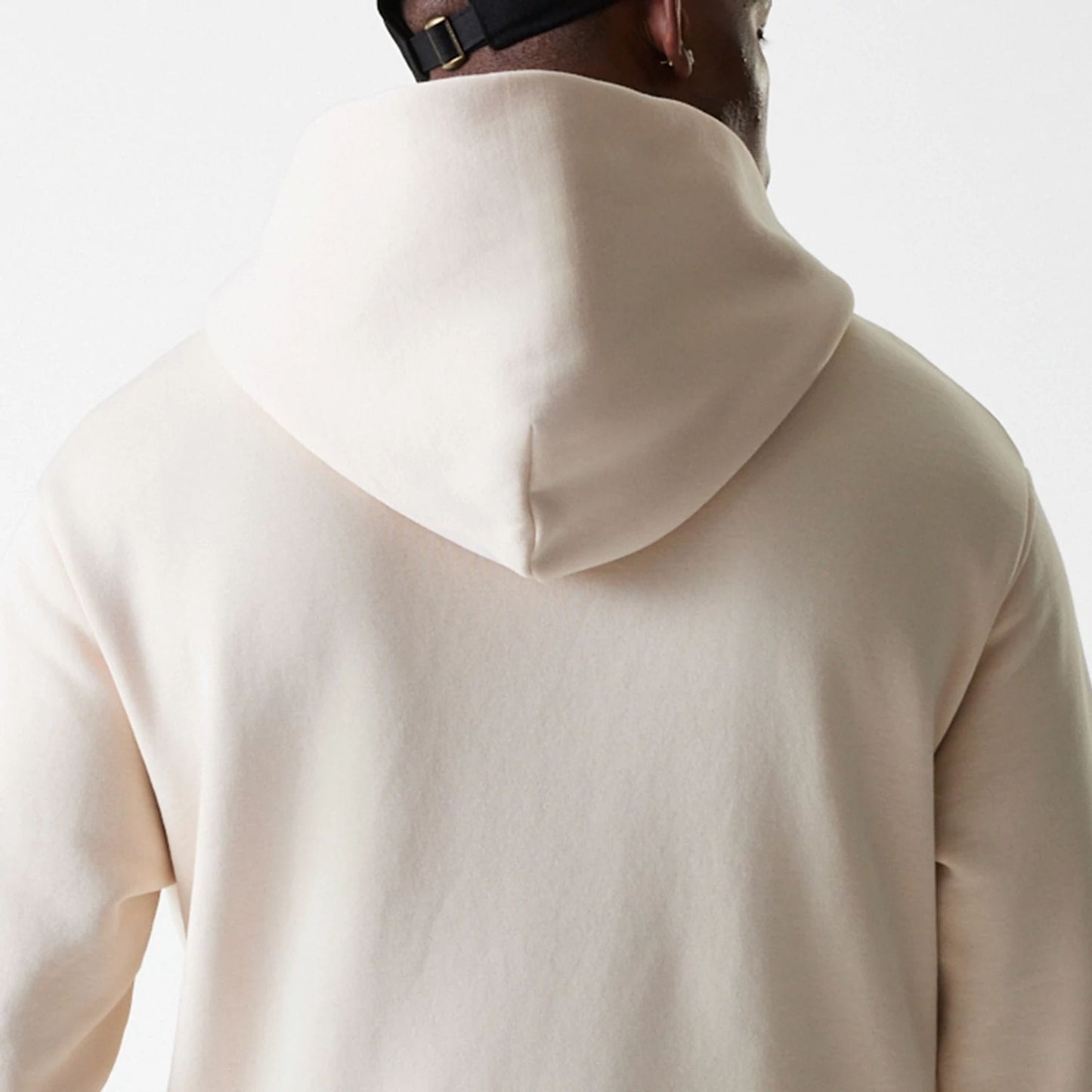 The Male model is wearing New Era Tech Light Beige Oversized Pullover Hoodie 8