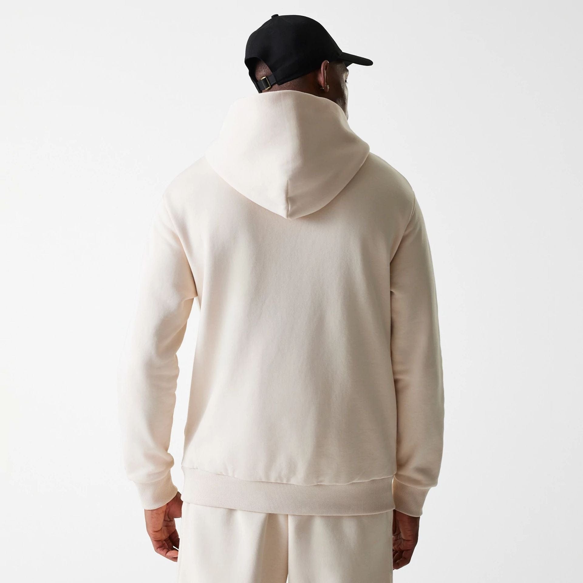 The Male model is wearing New Era Tech Light Beige Oversized Pullover Hoodie 2