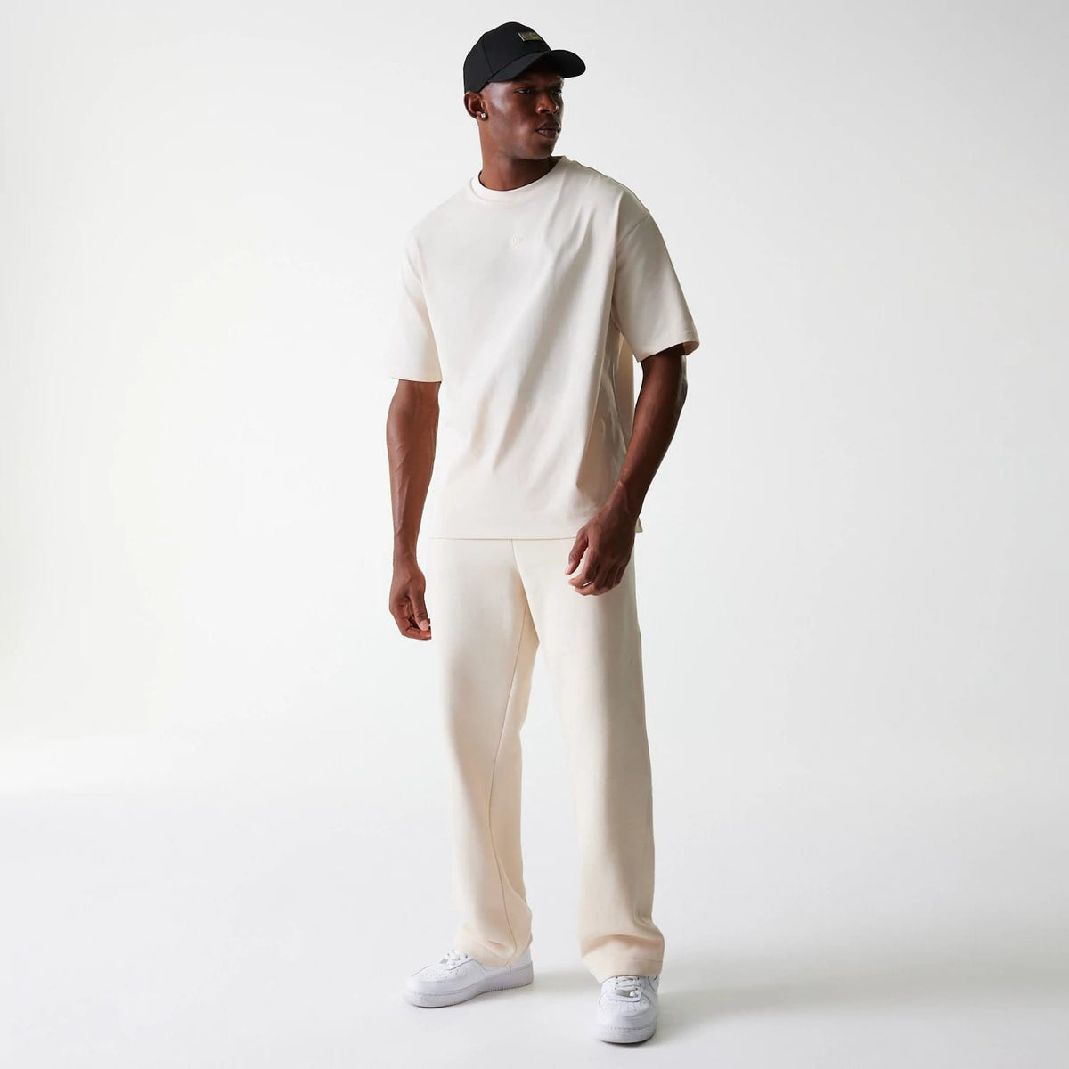 The Male model is wearing New Era Light Beige Straight Leg Joggers 3