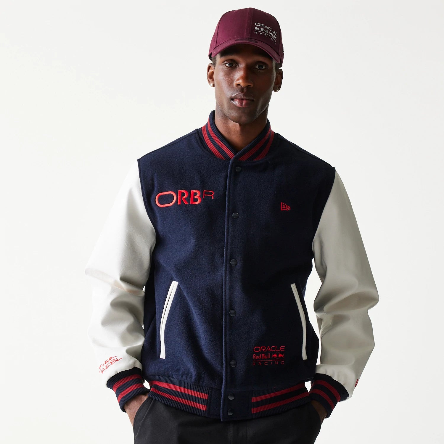 The Male model is wearing Red Bull Racing Dark Blue Varsity Jacket 1