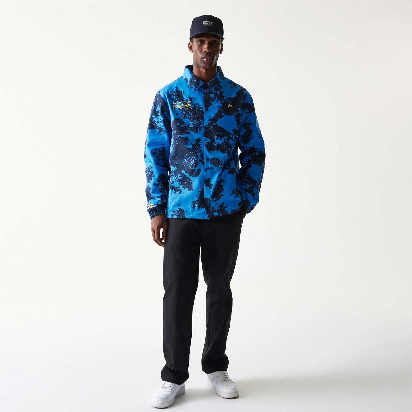 The Male model is wearing Red Bull Racing Blue Oversized Coaches Jacket 8