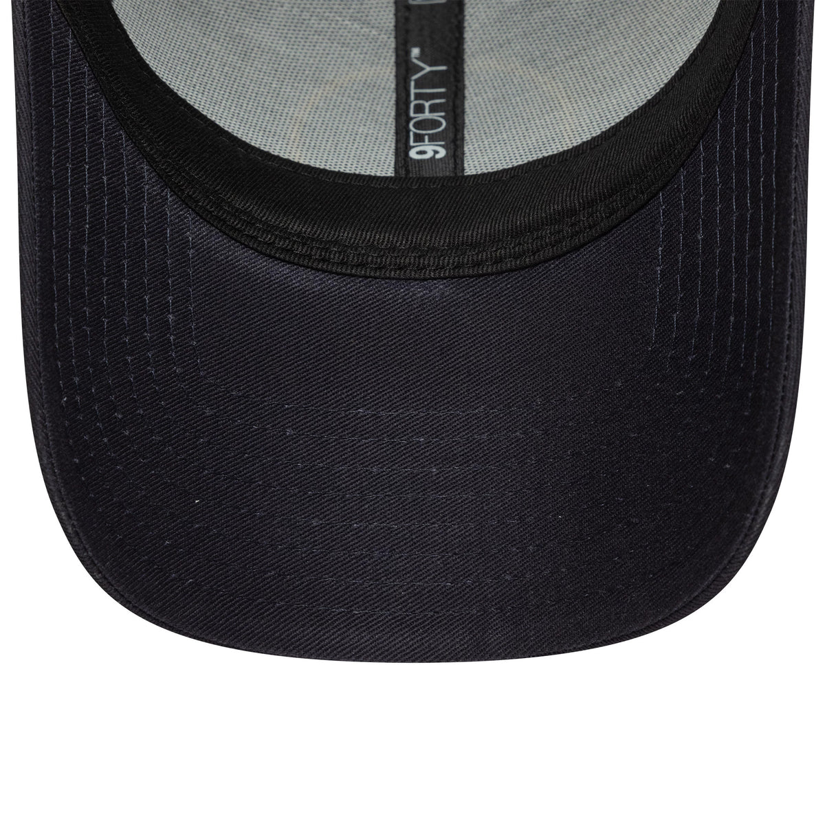 Chelsea FC Lion Crest Core Navy New Era 9FORTY Cap, inside view showing a black sweatband with grey taping bearing the 9FORTY logo and a navy undervisor featuring detailed stitching around the edge.