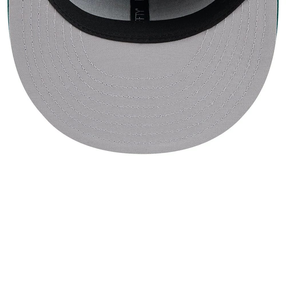 Tulsa Drillers MiLB Theme Night Green New Era 59FIFTY Fitted Cap, inside view showing grey undervisor with black taping and part of the gold 59FIFTY size sticker on the underside of the visor.