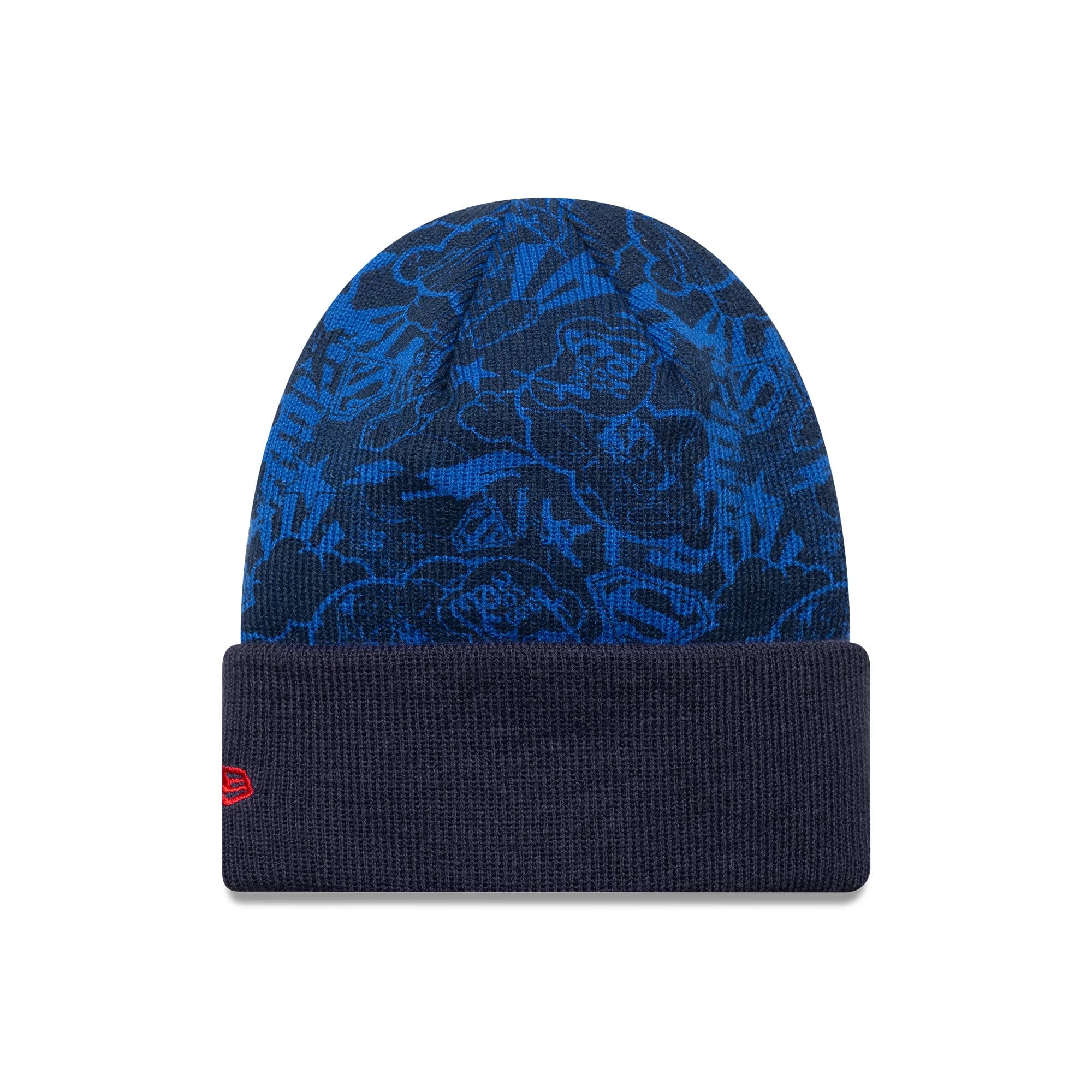 New Era Superman Youth DC Blue Cuff Knit Beanie Hat, front view showing a detailed floral and logo pattern in blue tones on the crown, with a solid dark blue cuff featuring a red embroidered New Era flag logo on the left side.