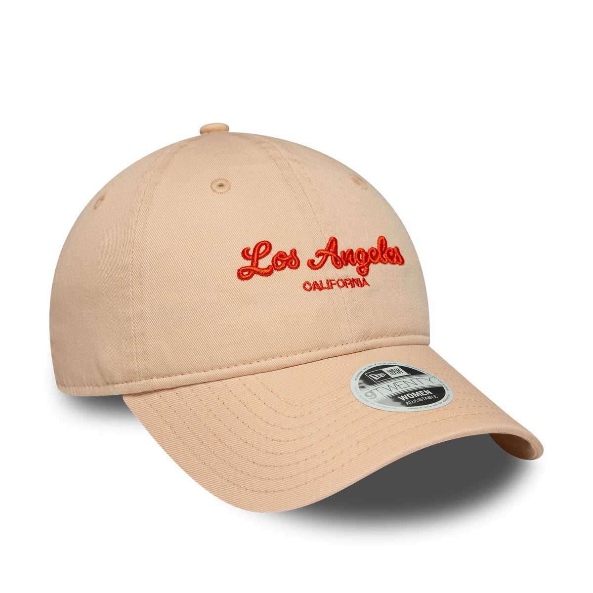 Womens New Era City Pastel Pink 9TWENTY Adjustable Cap, three-quarter view with orange embroidered Los Angeles California lettering on the front panel, beige curved visor and 9TWENTY size sticker.