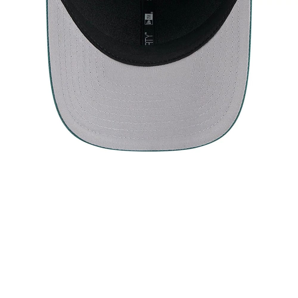 Philadelphia Eagles NFL Team Dark Green New Era 9FORTY M-Crown Cap, inside view showing black sweatband and taping with a grey undervisor, showcasing meticulous stitching detail across the underside of the visor.