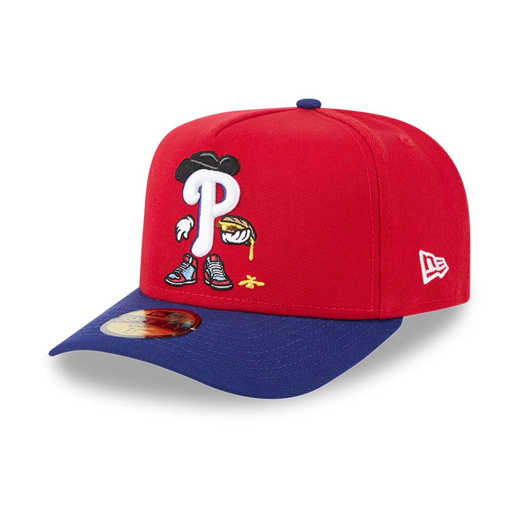 Philadelphia Phillies MLB Cartoon Red New Era 59FIFTY A-Frame Fitted Cap, three-quarter view with a cartoon-style embroidered Phillies logo on the front panel, blue visor with gold 59FIFTY size sticker, and New Era flag logo on the left side.