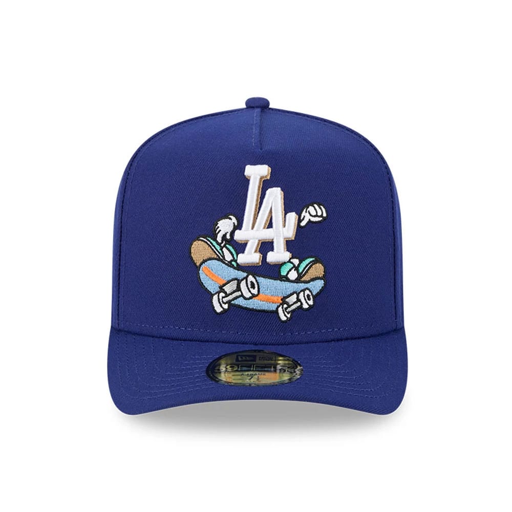 LA Dodgers MLB Cartoon Dark Blue New Era 59FIFTY A-Frame Fitted Cap, front view showing a white LA logo embroidered above a cartoon skateboarding figure, with a gold 59FIFTY size sticker centred on the visor.