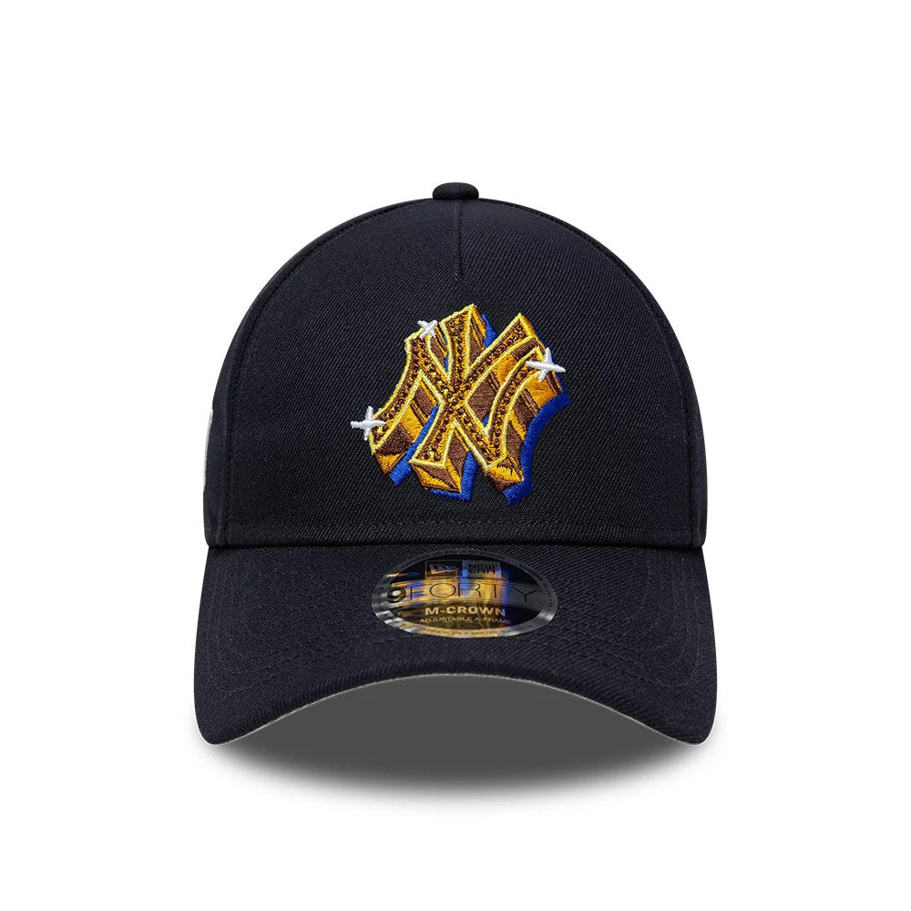New York Yankees MLB Emblem Navy New Era 9FORTY M-Crown A-Frame Adjustable Cap, front view showing raised golden yellow NY logo embroidery with white accents on the front panel above the 9FORTY size sticker on the curved visor.
