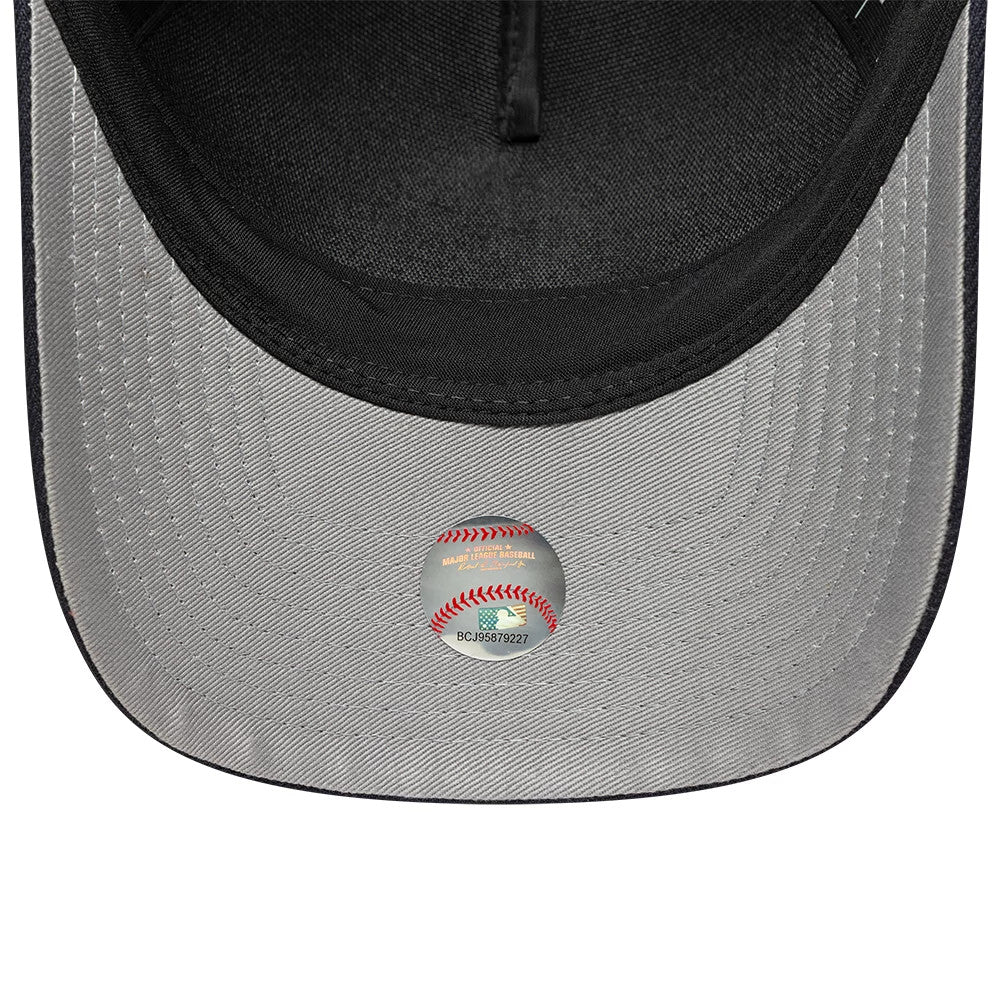 New York Yankees MLB Emblem Navy New Era 9FORTY M-Crown A-Frame Adjustable Cap, inside view showing grey undervisor with a baseball-themed sticker and black sweatband around the interior edge.