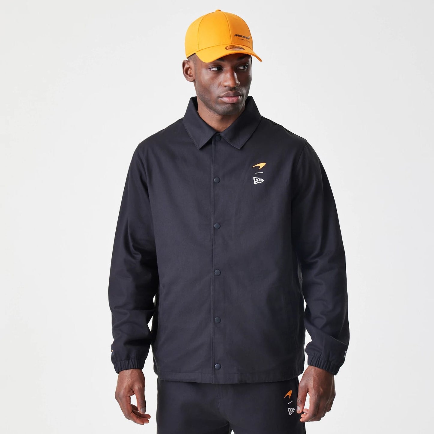 The Male model is wearing McLaren Racing McLaren Black Coaches Jacket 9
