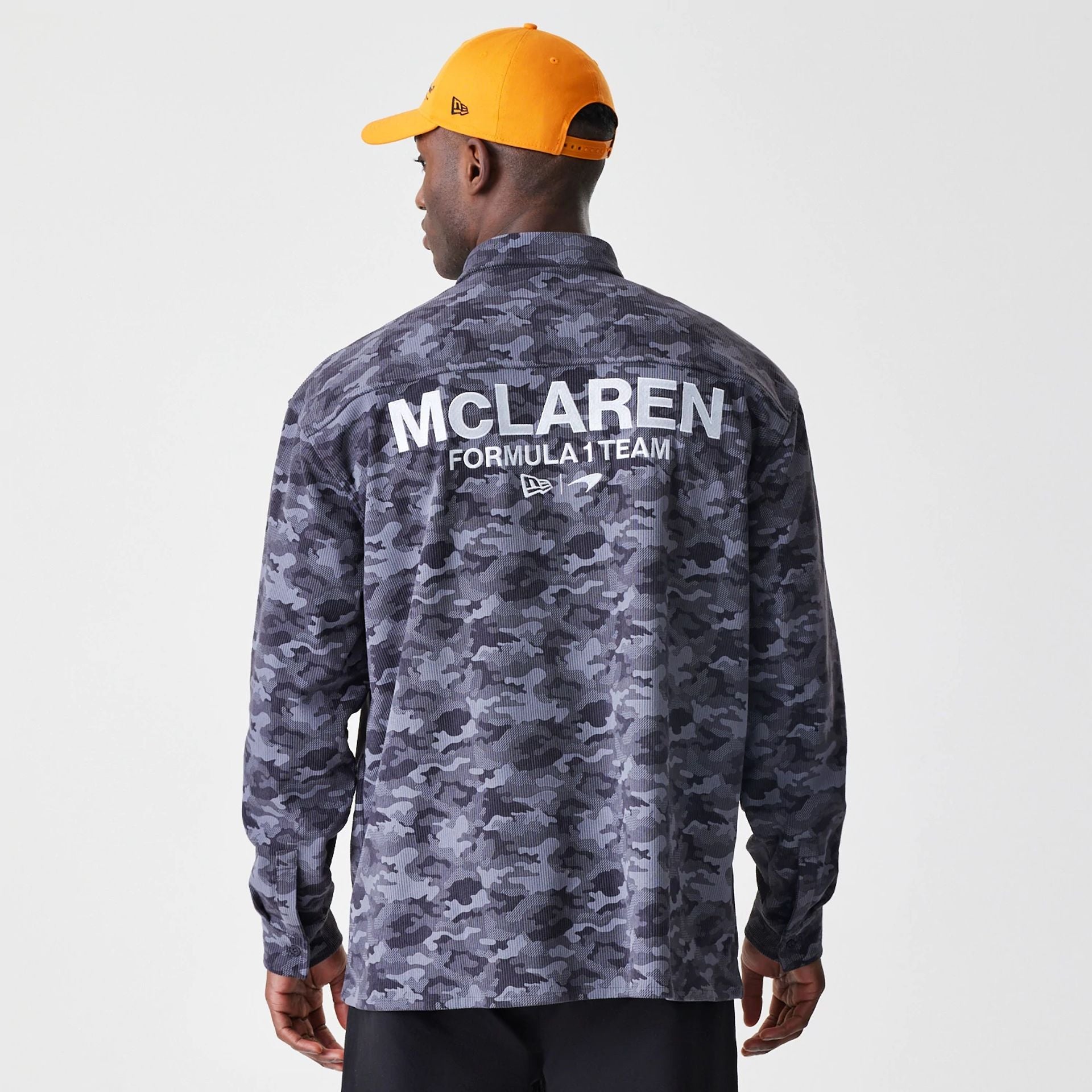 The Male model is wearing McLaren Racing Graphic Dark Grey Long Sleeve Shirt 2