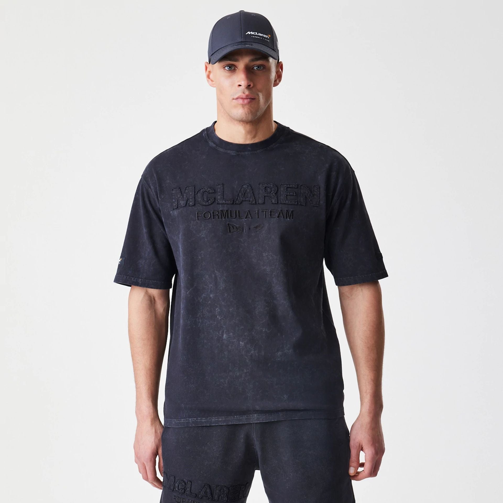 The Male model is wearing McLaren Racing Washed Black Oversized T-Shirt 1