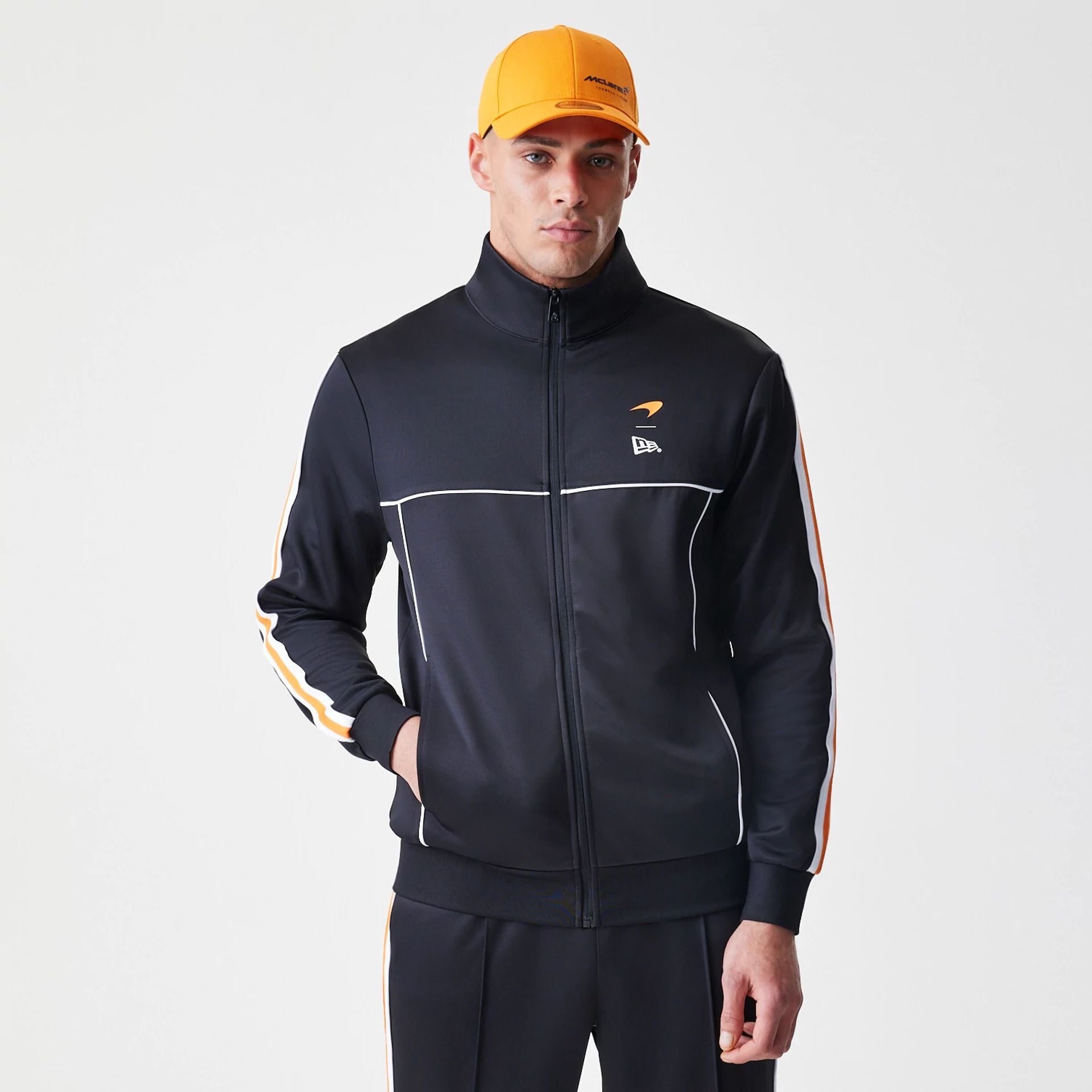 The Male model is wearing McLaren Racing Poly Black Track Jacket 1