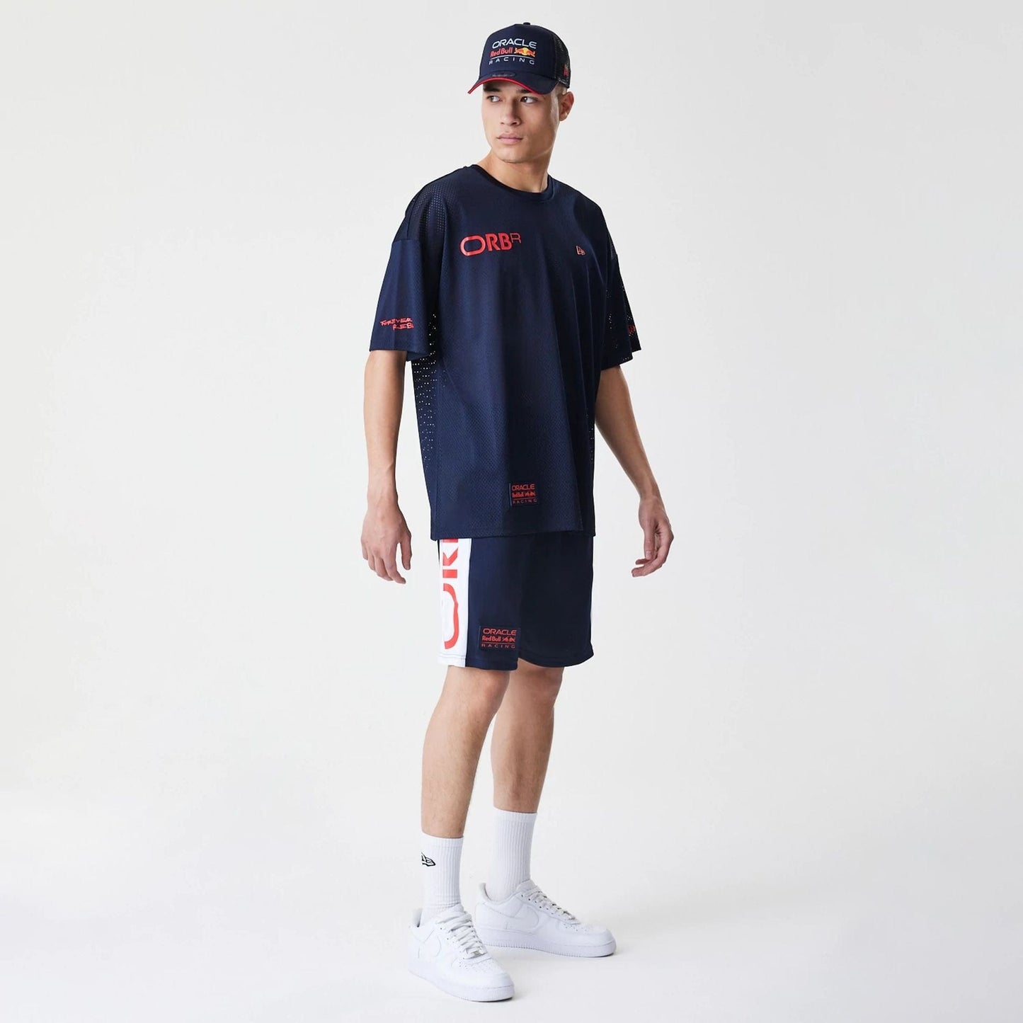 The Male model is wearing Red Bull Racing Graphic Mesh Dark Blue Shorts 8