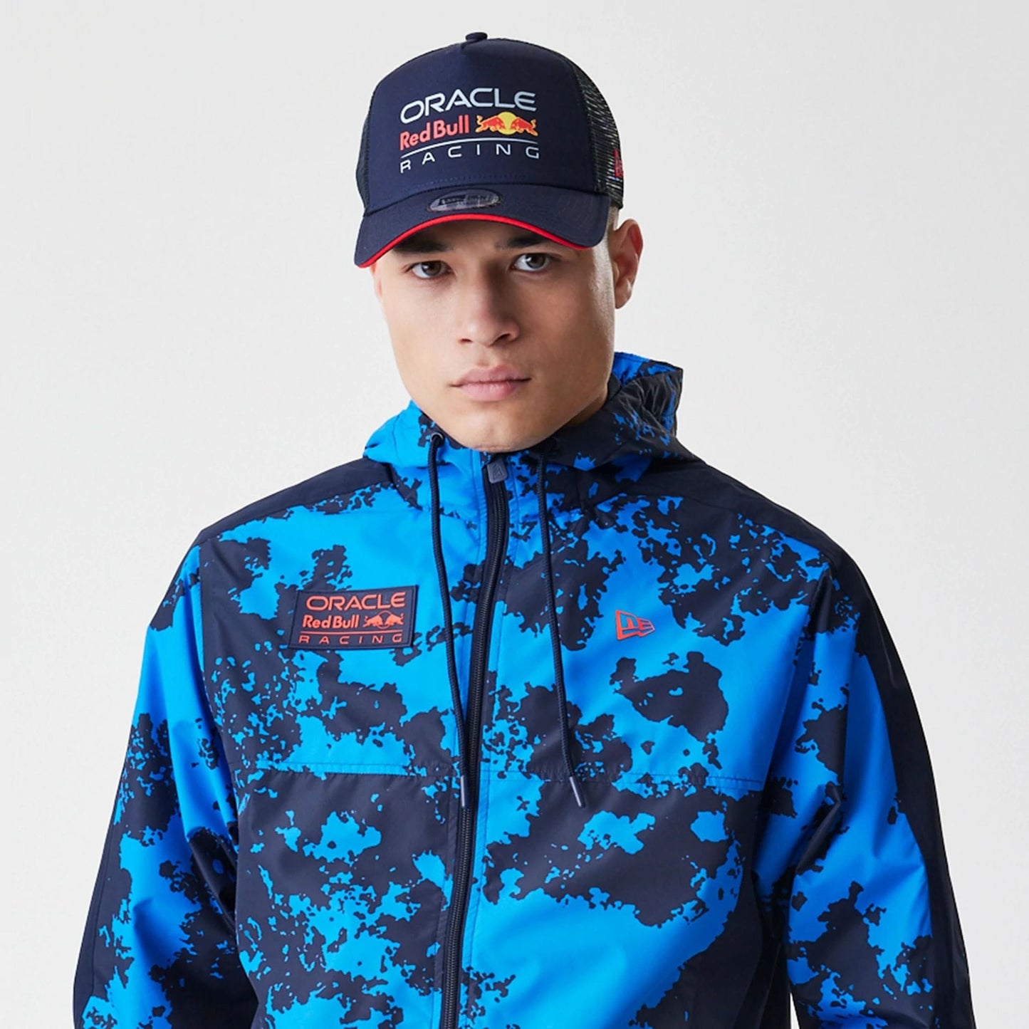 The Male model is wearing Red Bull Racing Blue Windrunner Jacket 7
