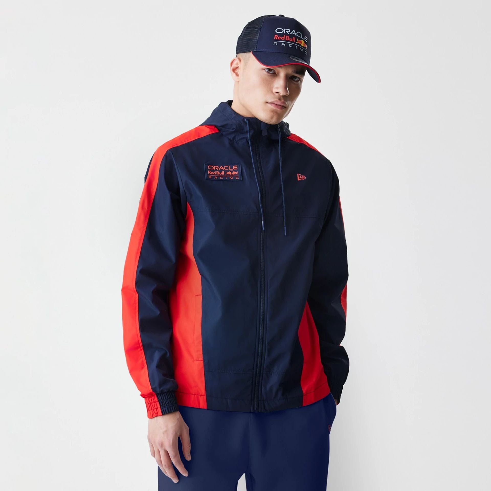The Male model is wearing Red Bull Racing Dark Blue Windrunner Jacket 1