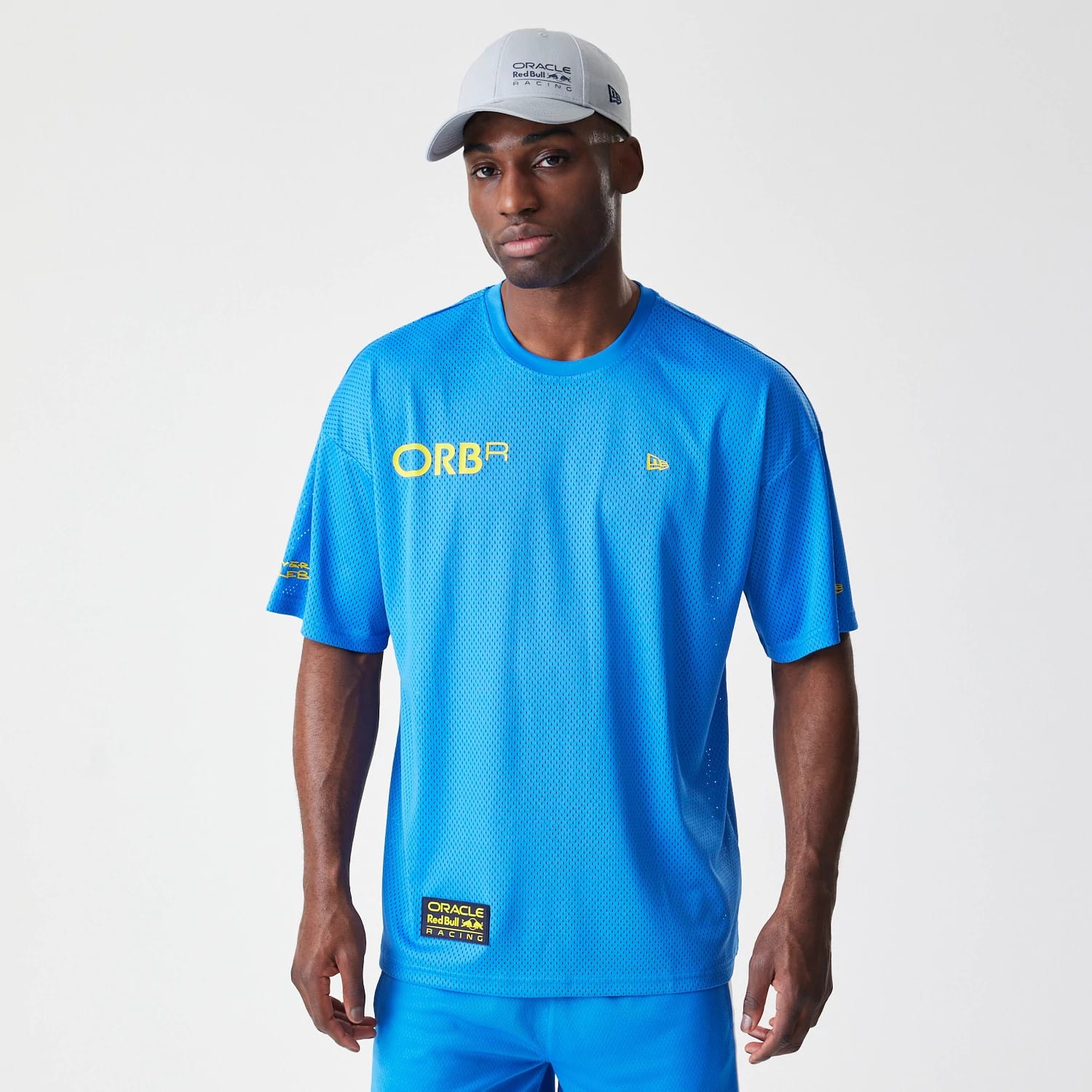 The Male model is wearing Red Bull Racing Graphic Mesh Blue Oversized T-Shirt 1