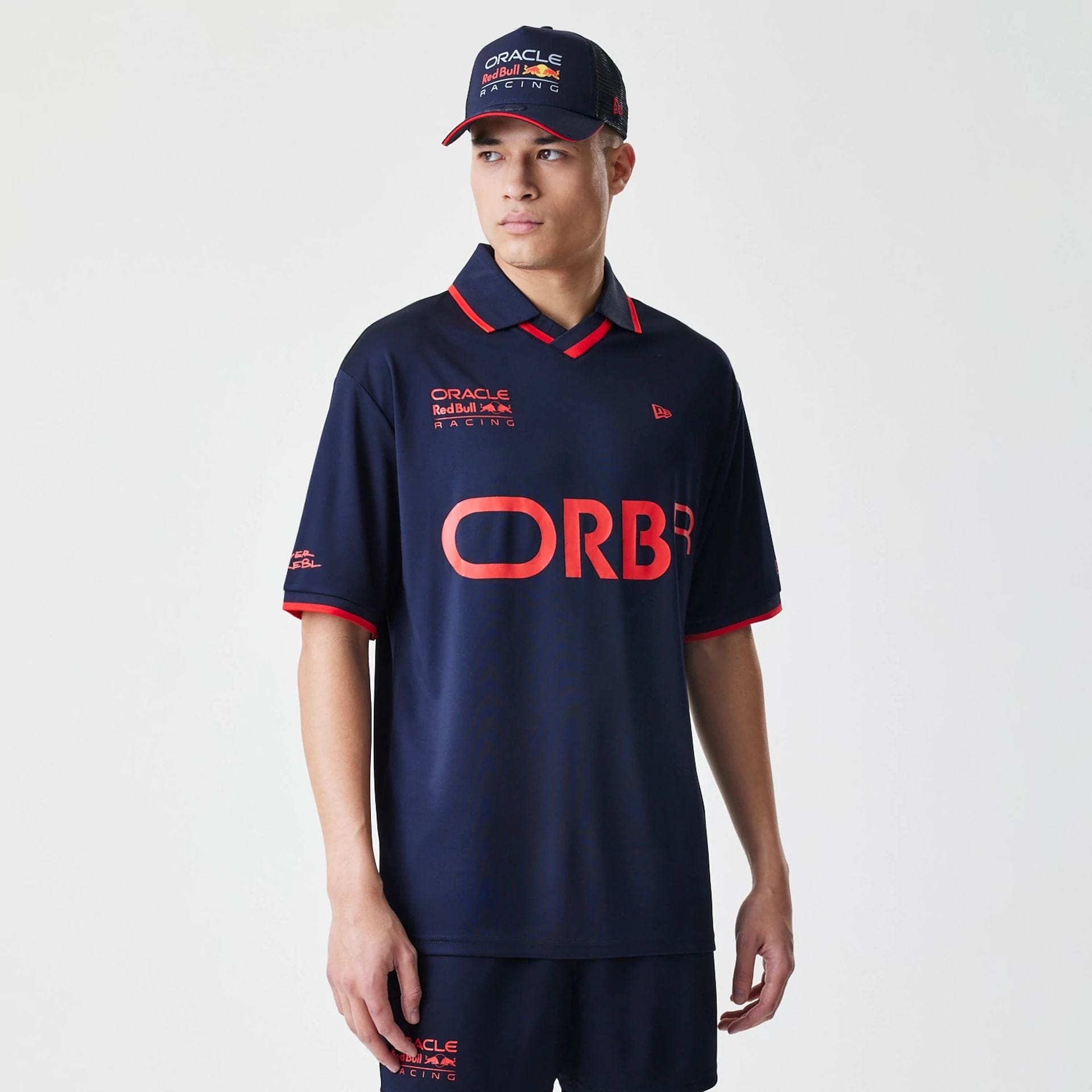 The Male model is wearing Red Bull Racing Graphic Dark Blue Football Jersey 1