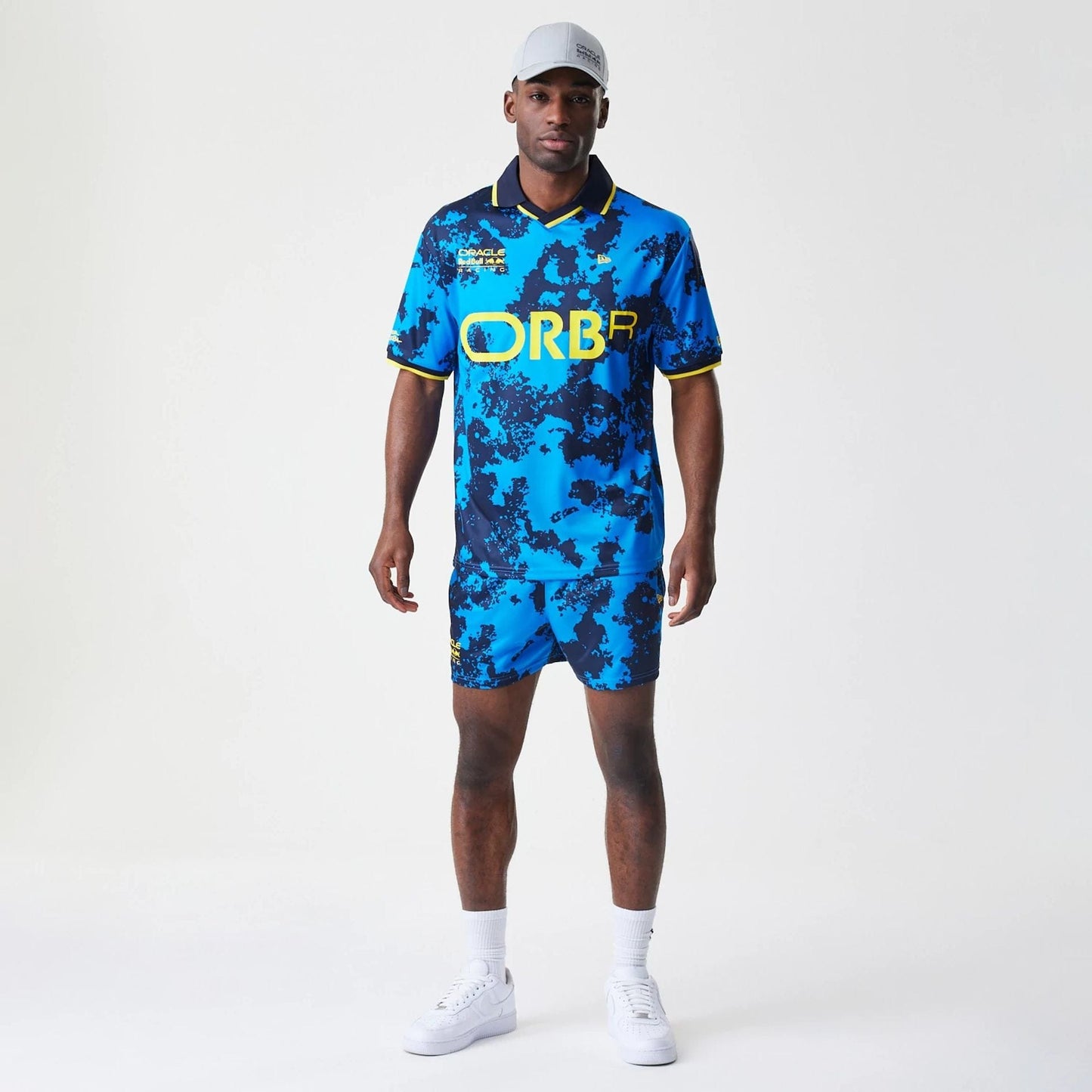 The Male model is wearing Red Bull Racing Graphic Blue Football Jersey 8