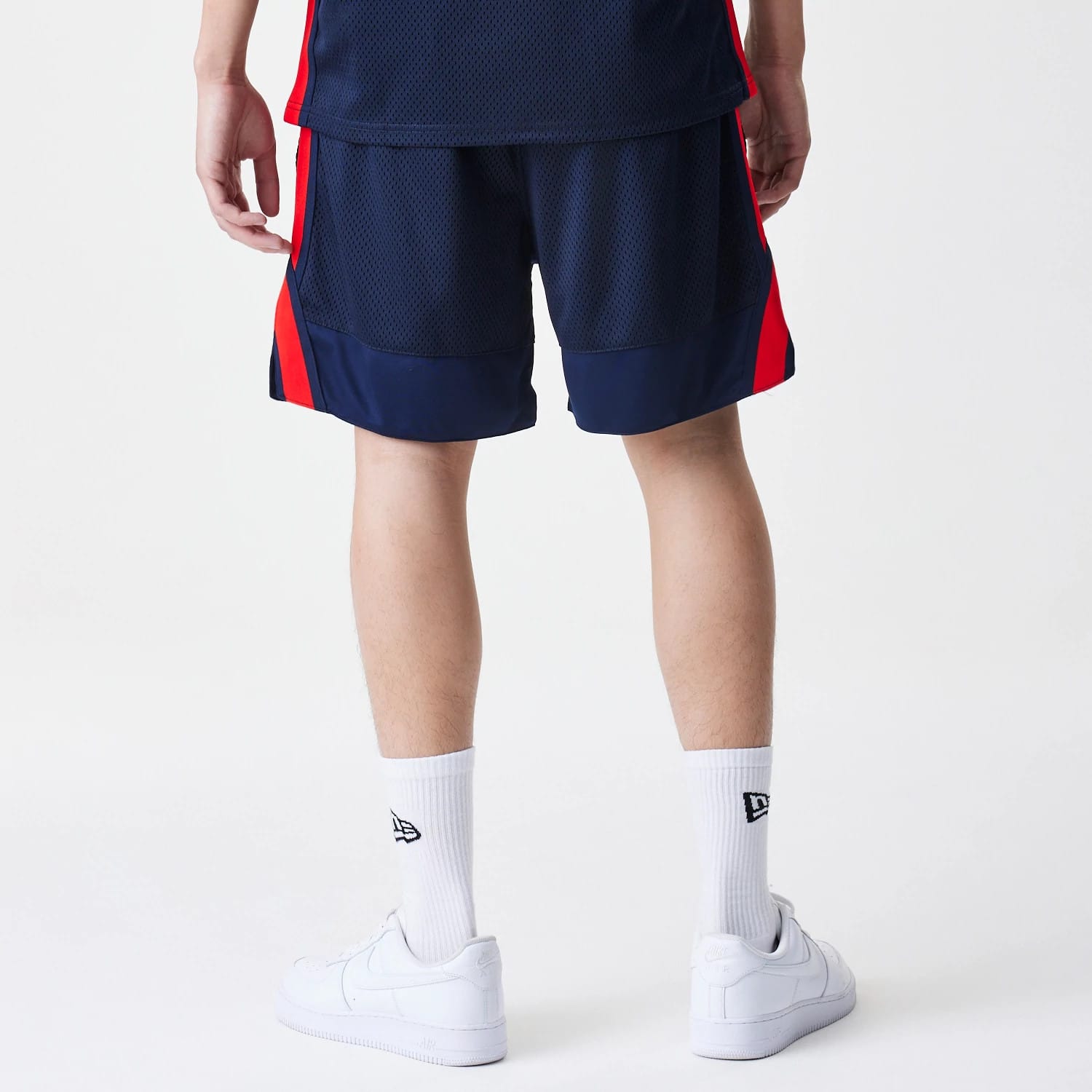 The Male model is wearing Red Bull Racing Basketball Mesh Dark Blue Shorts 2