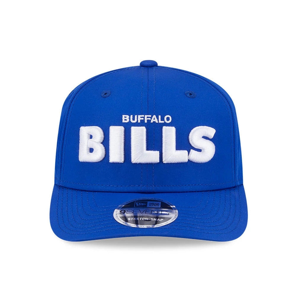 Buffalo Bills NFL Coach Blue New Era 9SEVENTY Stretch Snap Adjustable Cap, front view showing raised white embroidered BUFFALO BILLS lettering on the structured blue crown with a curved visor and 9SEVENTY size sticker.