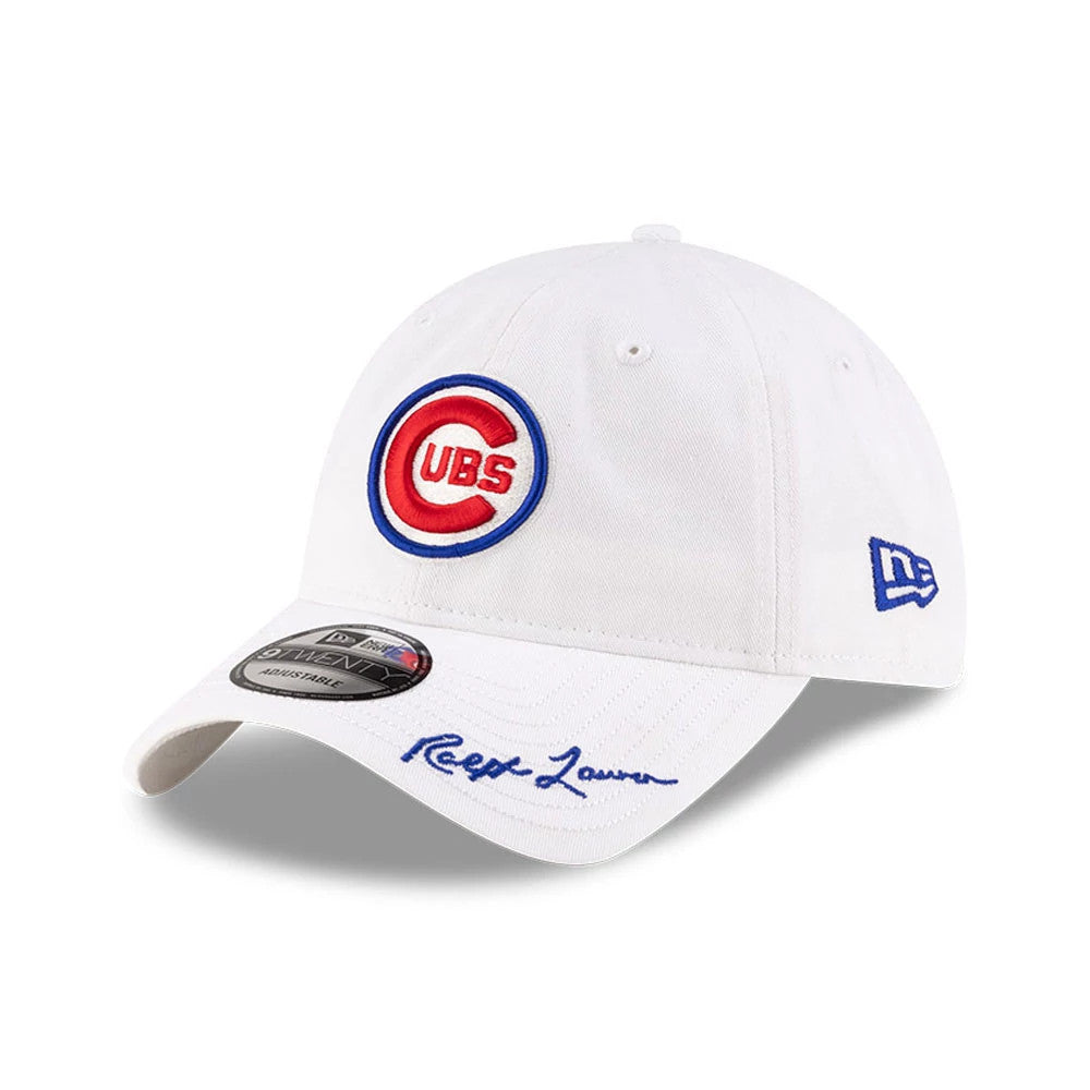 Chicago Cubs Ralph Lauren X MLB Open White New Era 9TWENTY Adjustable Cap, three-quarter view showing the red and blue Cubs front logo, embroidered Ralph Lauren signature on the white curved visor, and New Era flag logo on the left side.