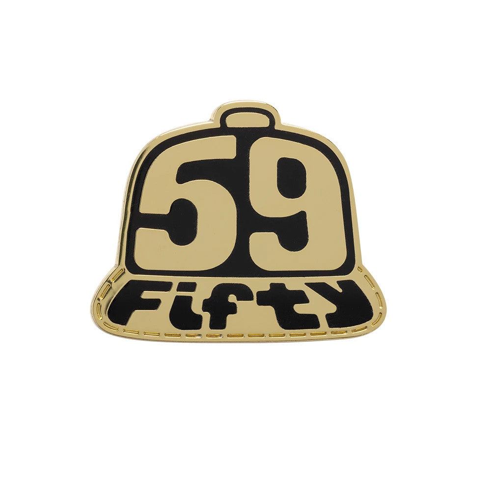 New Era 59FIFTY Day Cap Gold Pin Badge, front view showing a gold and black pin shaped like a cap with the number 59 on the crown and the word Fifty embossed below, outlined with a gold edge.