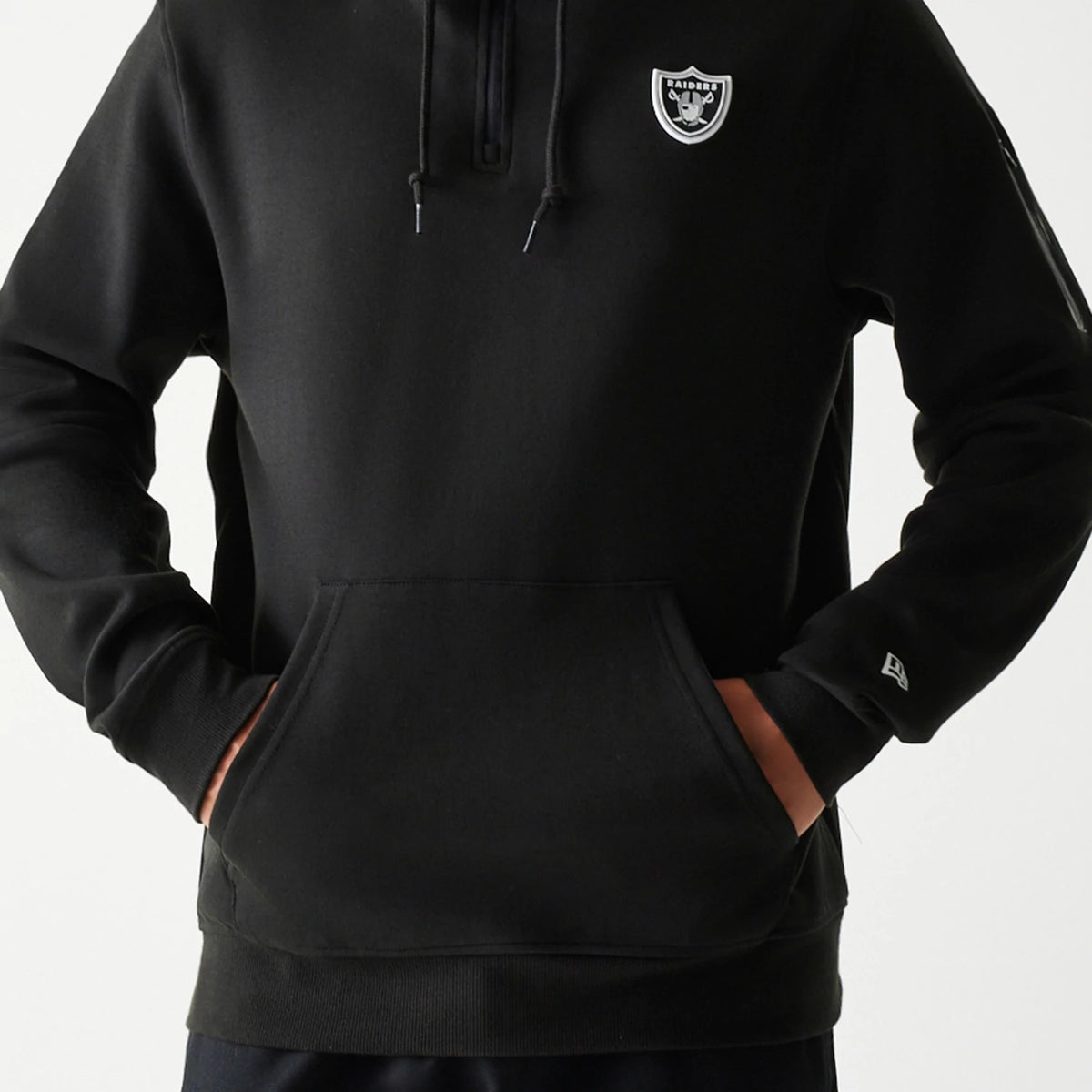 New Era Las Vegas Raiders NFL 3RD Down Black Pullover Hoodie, front view showing the black hoodie with a white embroidered Raiders logo on the chest, a kangaroo pocket, drawstrings at the neck, and an embroidered New Era logo on the left sleeve.
