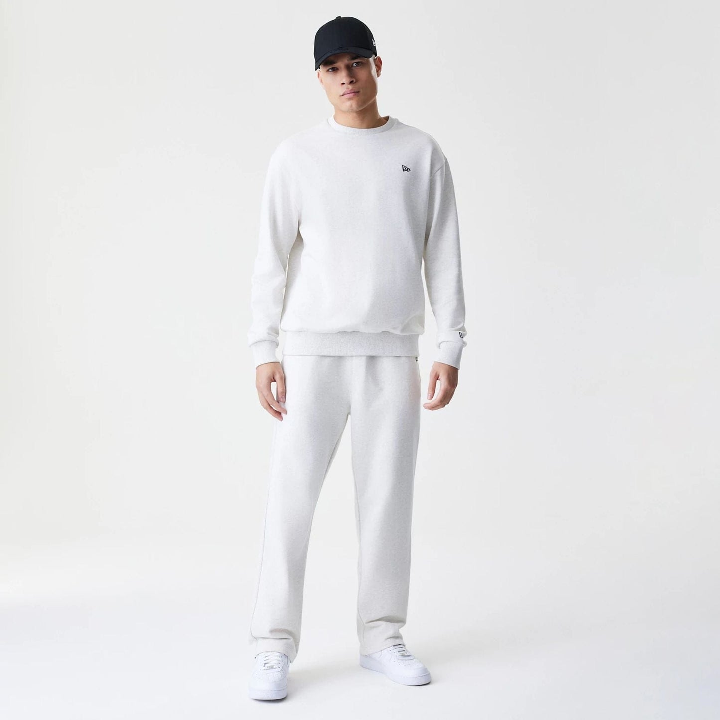 The Male model is wearing New Era Premium Essential Pastel Grey Oversized Crew Neck Sweater 8