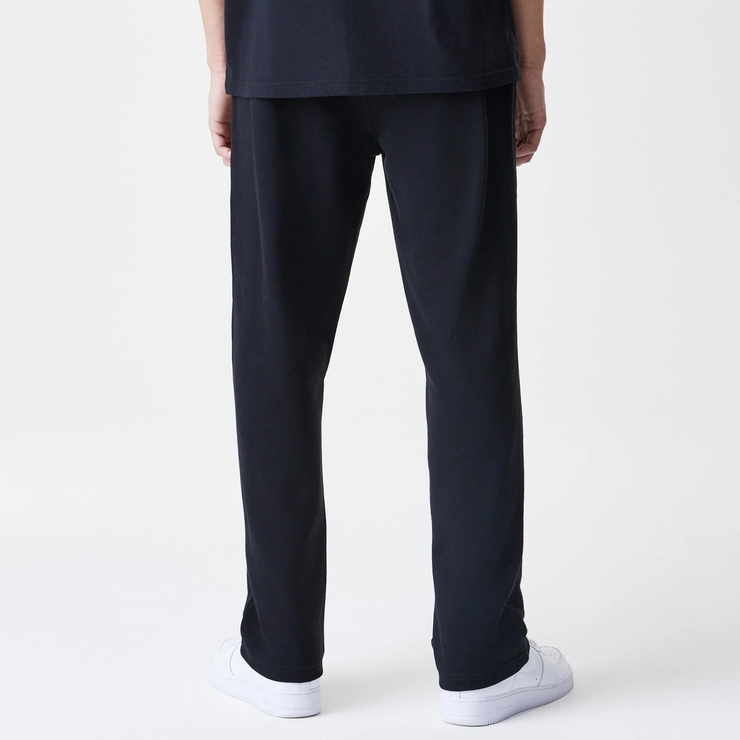 The Male model is wearing New Era Premium Essential Black Joggers 2