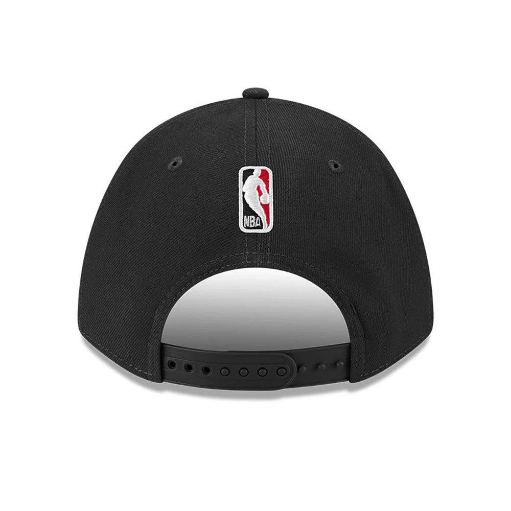 Chicago Bulls NBA Team Black New Era 9FORTY M-Crown Adjustable Cap, rear view showing the embroidered NBA logo at the centre back above the black adjustable strap and the curved black visor beneath.