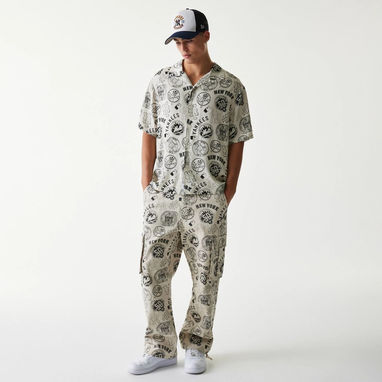 The Male model is wearing MLB Subway Series All Over Print Open White Short Sleeve Shirt 8