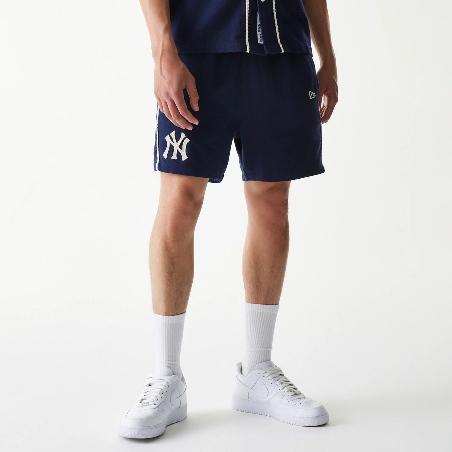 The Male model is wearing New York Yankees MLB Piping Navy Shorts 8