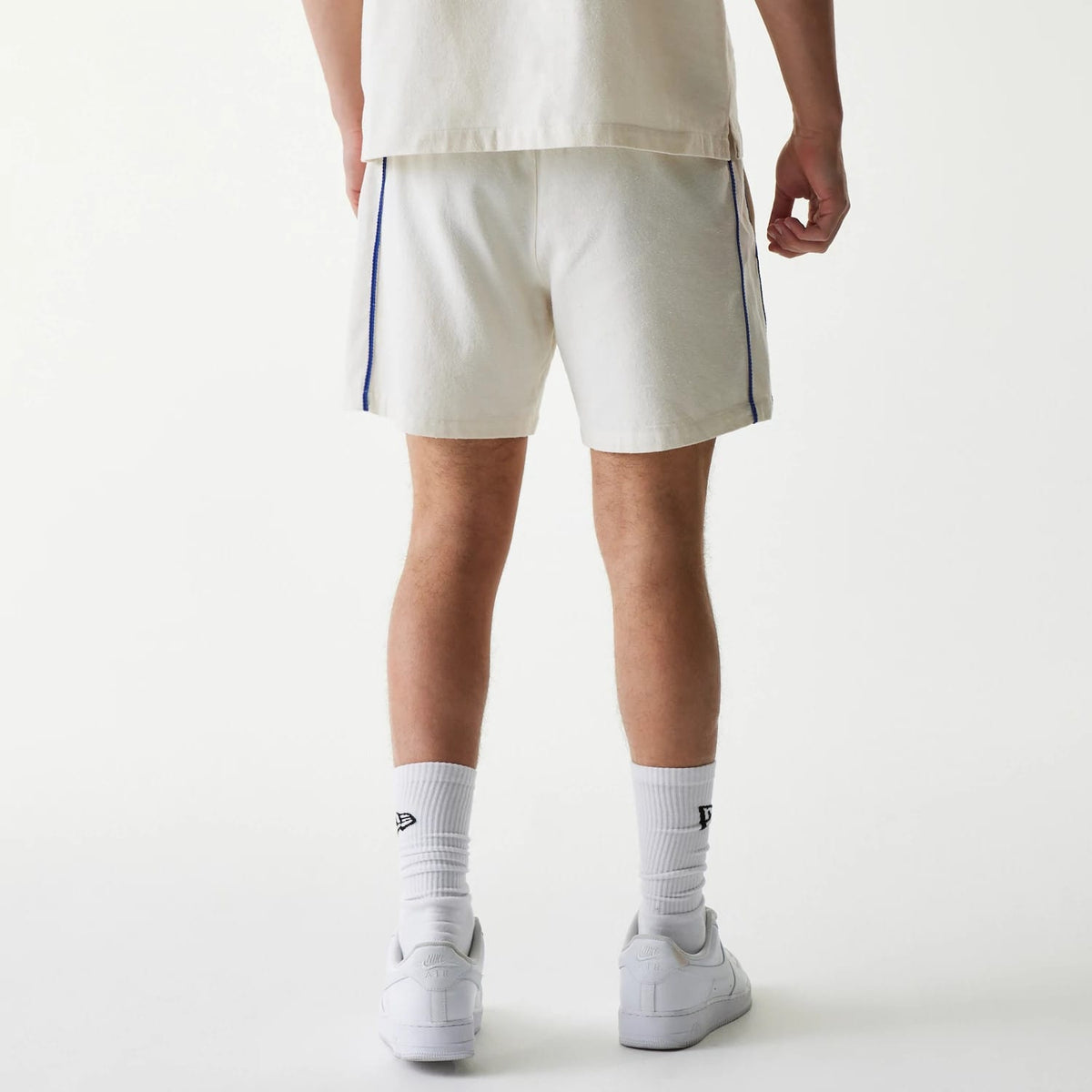 The Male model is wearing New York Mets MLB Piping Open Cream Shorts 2