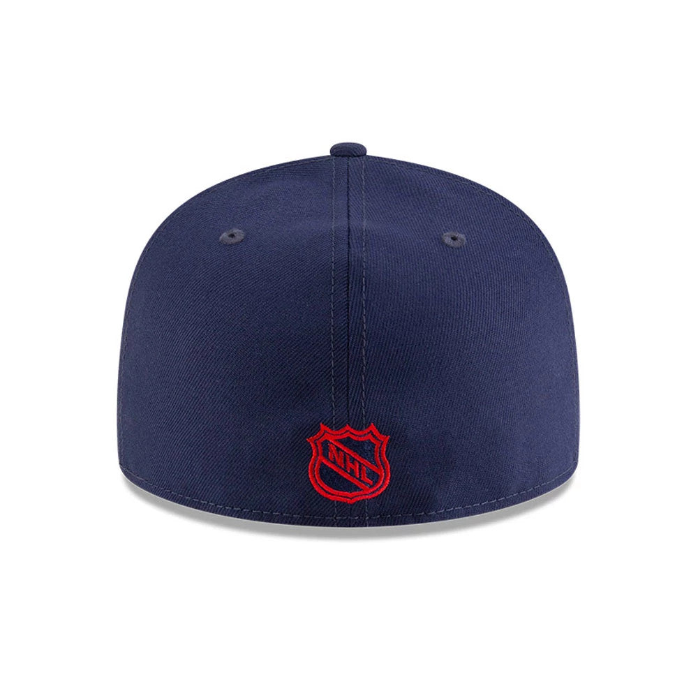 Kansas City Scouts NHL Basic Navy New Era 59FIFTY Fitted Cap, rear view showing the red embroidered NHL shield logo at the centre of the back panels, set on a structured navy crown with matching eyelets and top button.