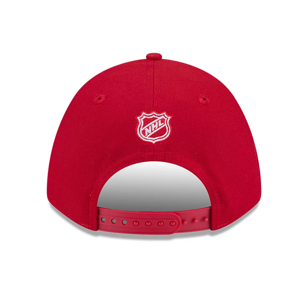 Detroit Red Wings NHL Team Red New Era 9FORTY M-Crown Adjustable Cap, rear view showing the white embroidered NHL shield logo centred on the back panel, with a classic red adjustable snapback closure and red eyelets.